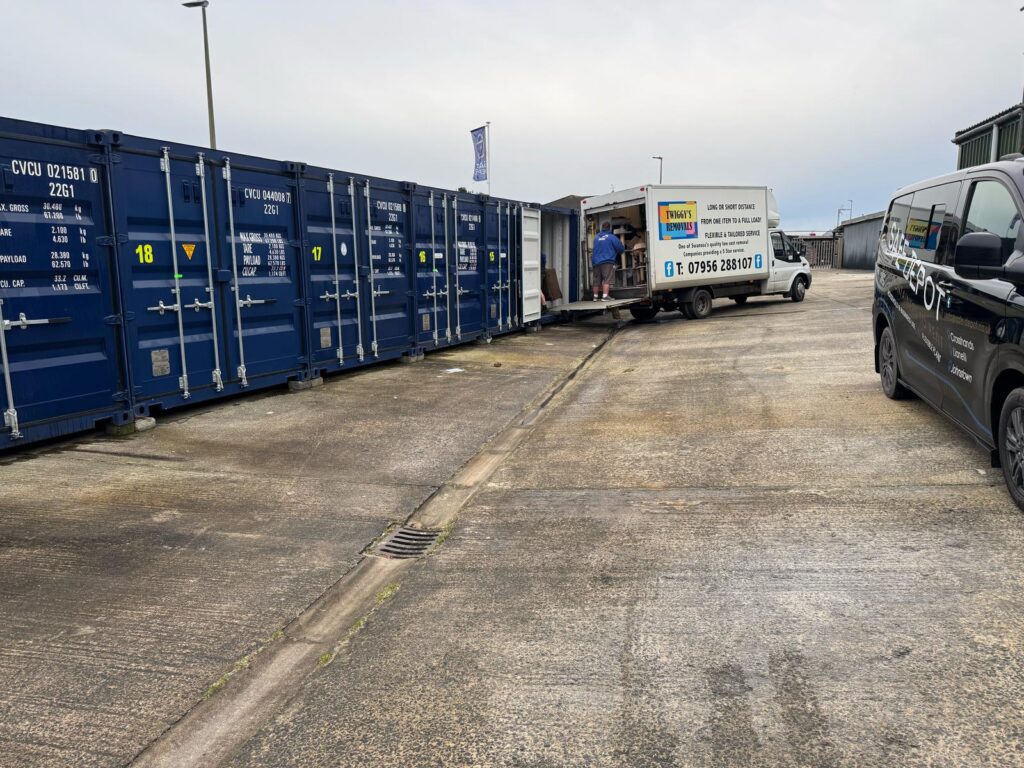 Removals company moving items in to a storage container in Cross Hands